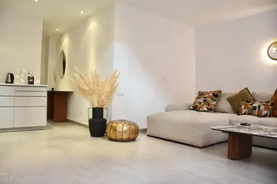 a living room with a couch and a table at M17-Le Duplex-Balcon-Piscine-Majorelle in Marrakech
