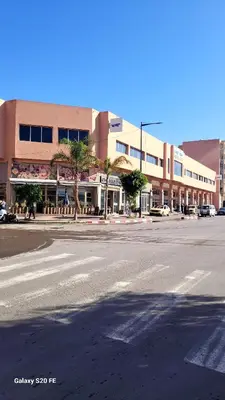 an empty street in front of a large building at LE 44 face a la gare CTM et a 10mn de L'aéroport in Marrakech