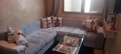 a living room with a couch and a coffee table at Studio Rmila 1 in Marrakech