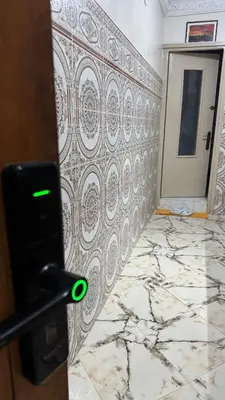 a room with a wall with a design on it at Airport Apartment 5 minutes walk, perfect for Early & Late Flights in Marrakech