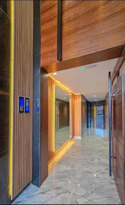 a hallway of an office building with the entrance to it at Jnane Guéliz 2CH parking wifi Marrakech centre in Marrakech
