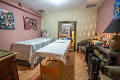 a small bedroom with a bed and a mirror at Amelkis golf villa 3 ch private pool in Marrakech