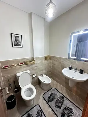 a bathroom with a toilet and a sink at Spacious apartment in Marrakech in Marrakech