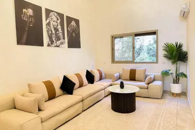 a living room with a couch and a table at Spacious apartment in Marrakech in Marrakech