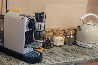 a coffee maker on a counter with a tea kettle at Palm Nest in Marrakech