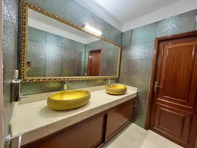a bathroom with a large gold sink and a mirror at Villa De Luxe Marrakech Targa in Marrakech