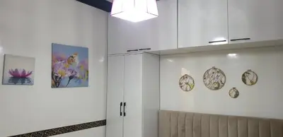 a room with white walls and a ceiling with paintings at Portes de Guéliz in Marrakech