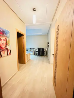 a hallway of a room with a painting on the wall at Le saphir home in Marrakech