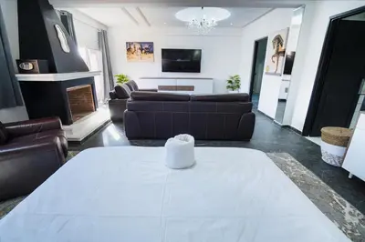 a living room with a couch and a table at Villa Bonsai Marrakech in Marrakech