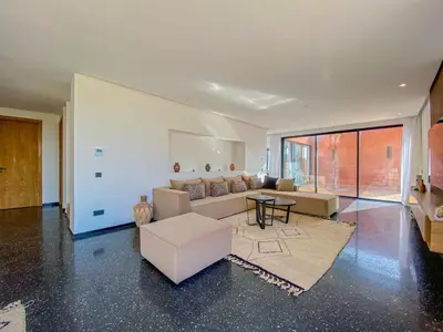 a living room with a couch and a table at Villa Warda Luxe & Confort in Marrakech
