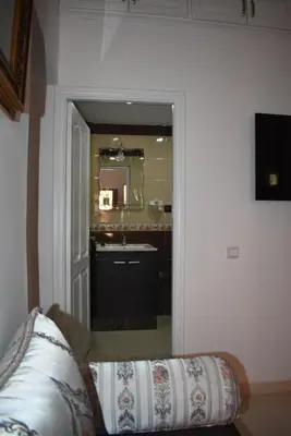 a bathroom with a sink and a mirror at Apartment A Zaitone G19 in Marrakech