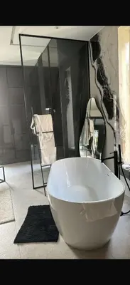 a large white bowl sitting in a room with a mirror at Villa coco in Marrakech