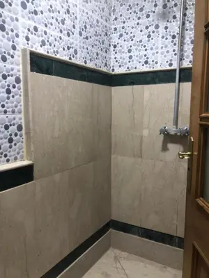 a bathroom with a shower with a glass door at Résidence Babylone Y - Appartement Studio in Marrakech