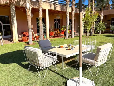 a table and two chairs and a table and chairsitures at Palais Bohemia in El Rhechat