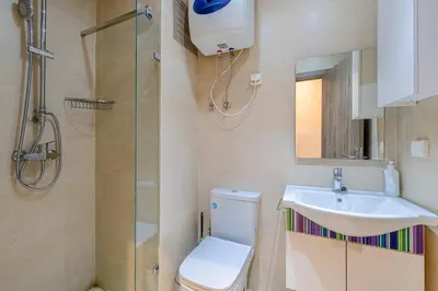 a bathroom with a toilet and a sink and a shower at Brand New and Stylish appart hotel Best location in Marrakech
