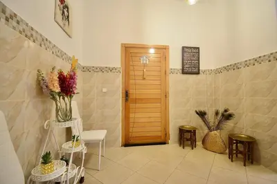a room with a door and a vase of flowers at Gold Holidays 02 in Marrakech