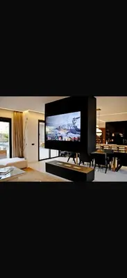 a flat screen tv sitting on a table in a living room at Villa coco in Marrakech