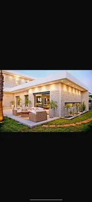 a large house with couches in the yard at Villa coco in Marrakech