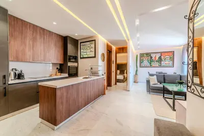an open kitchen and living room in a house at Charming Apartment in Hyper Center Modernity in Marrakech