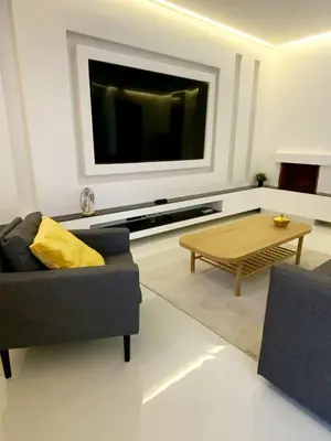 a living room with a couch and a coffee table at Modern Place in Marrakech