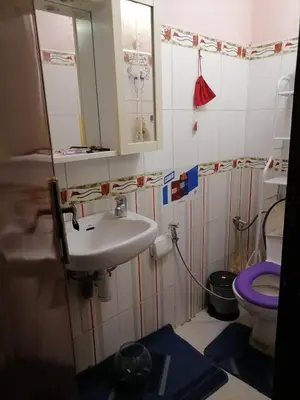 a bathroom with a sink and a toilet at Maison Mhamid9 in Marrakech