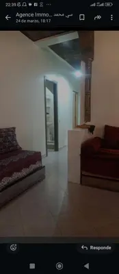 a bedroom with a bed and a couch in a room at Al andalous in Marrakech