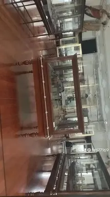 an empty kitchen with glass doors and wooden floors at Al andalous in Marrakech