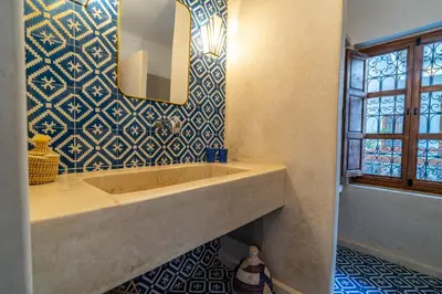 a bathroom with a sink and a mirror at Riad Sofia Marrakech in Marrakech