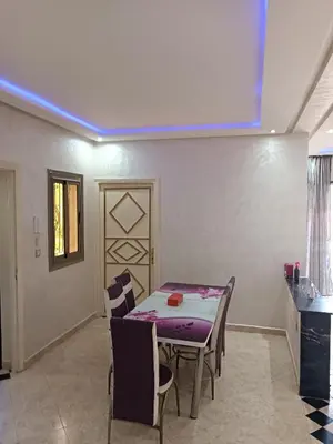 a dining room with a table and chairs at villa paradisiaque in Marrakech