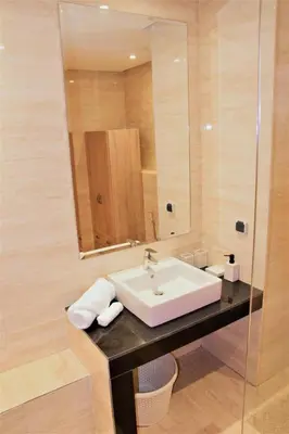 a bathroom with a sink and a mirror at Apartement in Marrakech Village Prestigia - 2 Bedrooms - private pool in Marrakech