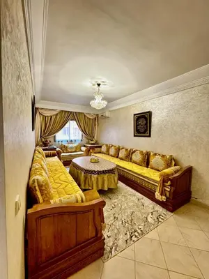 a large living room with couches and a table at spacieux appart familial avec 2 chambres in Marrakech