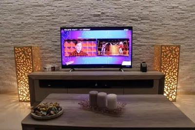 a tv sitting on top of a table in a room at New Résidence Miramas 2 in Marrakech