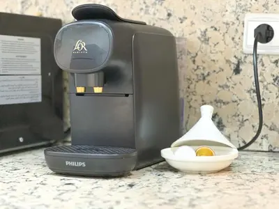 a coffee maker on a counter with a bowl of eggs at Elegant 2-Bedroom Duplex Downtown Private Terrace in Marrakech