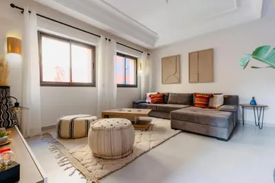 a living room with a couch and a table at Évasion aux portes de Majorelle in Marrakech