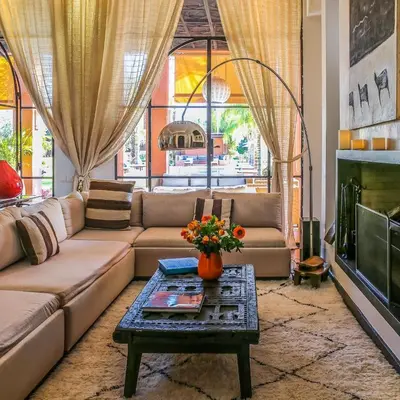 a living room with a couch and a coffee table at Villa Jardin Nomade in Marrakech