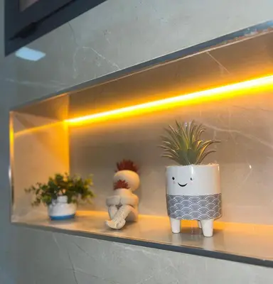 a shelf with two vases and a plant on it at Darraha- Ideal for early & Late flights-Near Marrakech airport 10 min- menara Garden 5 min-Transport support in Marrakech