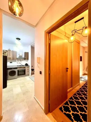 a kitchen with a door open to a kitchen with a kitchenasteryasteryasteryastery at séjournée chez mayaa in Marrakech