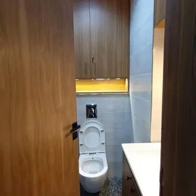 a bathroom with a toilet and a sink at Modern 2-Bedroom Family Flat in Central Marrakech in Marrakech