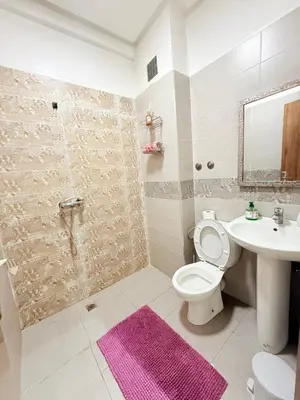 a bathroom with a toilet and a sink and a shower at N47 Confortable Près De Gueliz FAMILY in Marrakech