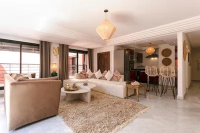 a living room with a couch and a table at Gueliz's Sun Marrakesh Centre in Marrakech