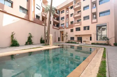 a swimming pool in front of a building at Signature Suite Private Pool in Marrakech