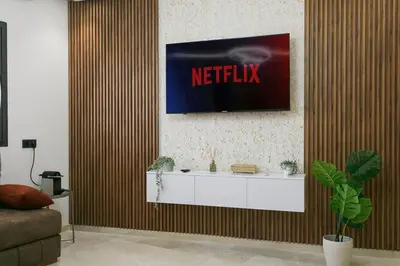 a living room with a television on a wall at Signature Suite Private Pool in Marrakech