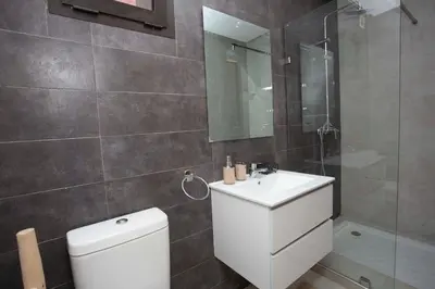 a bathroom with a toilet and a sink and a shower at Smart Loft in Marrakech