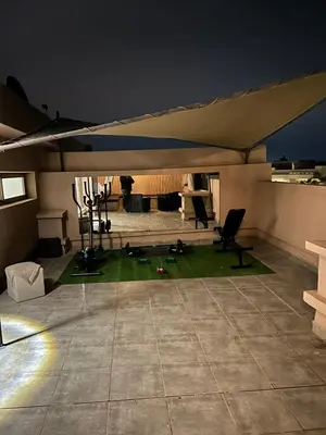 a large tent in a room with chairs and a table at Villa Tazinsky in Hbl Hmid