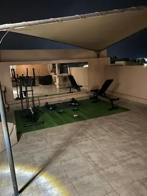 an overhead view of a gym with chairs in a room at Villa Tazinsky in Hbl Hmid