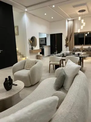 a living room with a couch and chairs at Villa Tazinsky in Hbl Hmid