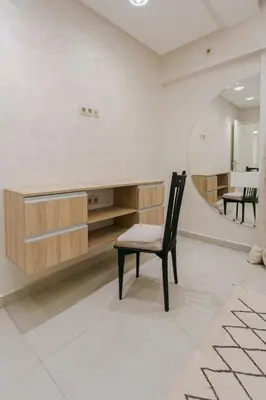 a chair in a room with a mirror at Majorelle Retreat in Marrakech