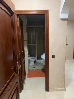 an open door to a bathroom with a toilet at Asmae in Marrakech