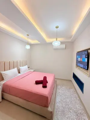 a bedroom with a bed and a flat screen tv at A21 Moderne Confort Au Cœur De Marrakech in Marrakech
