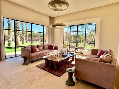 a large living room with couches and a table at Palais Kenza in Marrakech
